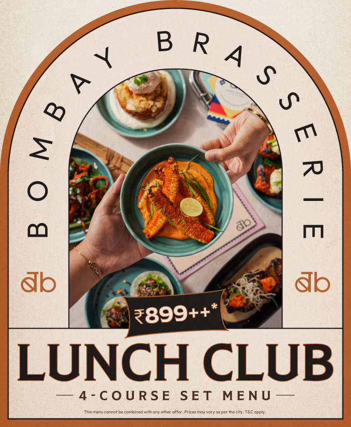 Bombay Brasserie Lunch Club promotional banner featuring a four course set menu starting at ₹899++ with an overhead view of Indian dishes being served. The design includes an arched frame, Bombay Brasserie branding, and highlights the weekday lunch offering.